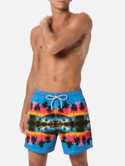 MC2 Saint Barth Man Mid-length Gustavia Swim-shorts With Palms Landscape Placed Print|AI CO-CREATED DESIGN BY RICKDICK - POWERED BY RED-EYE 9 MC2 Saint Barth Man Mid-length Gustavia Swim-shorts With Palms Landscape Placed Print|AI CO-CREATED DESIGN BY RICKDICK - POWERED BY RED-EYE -MC2 Saint Barth Shop UID GUS000900462F MAN SWIMSHORT GREEN 01